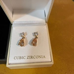 Brand new earrings and brand new ring.